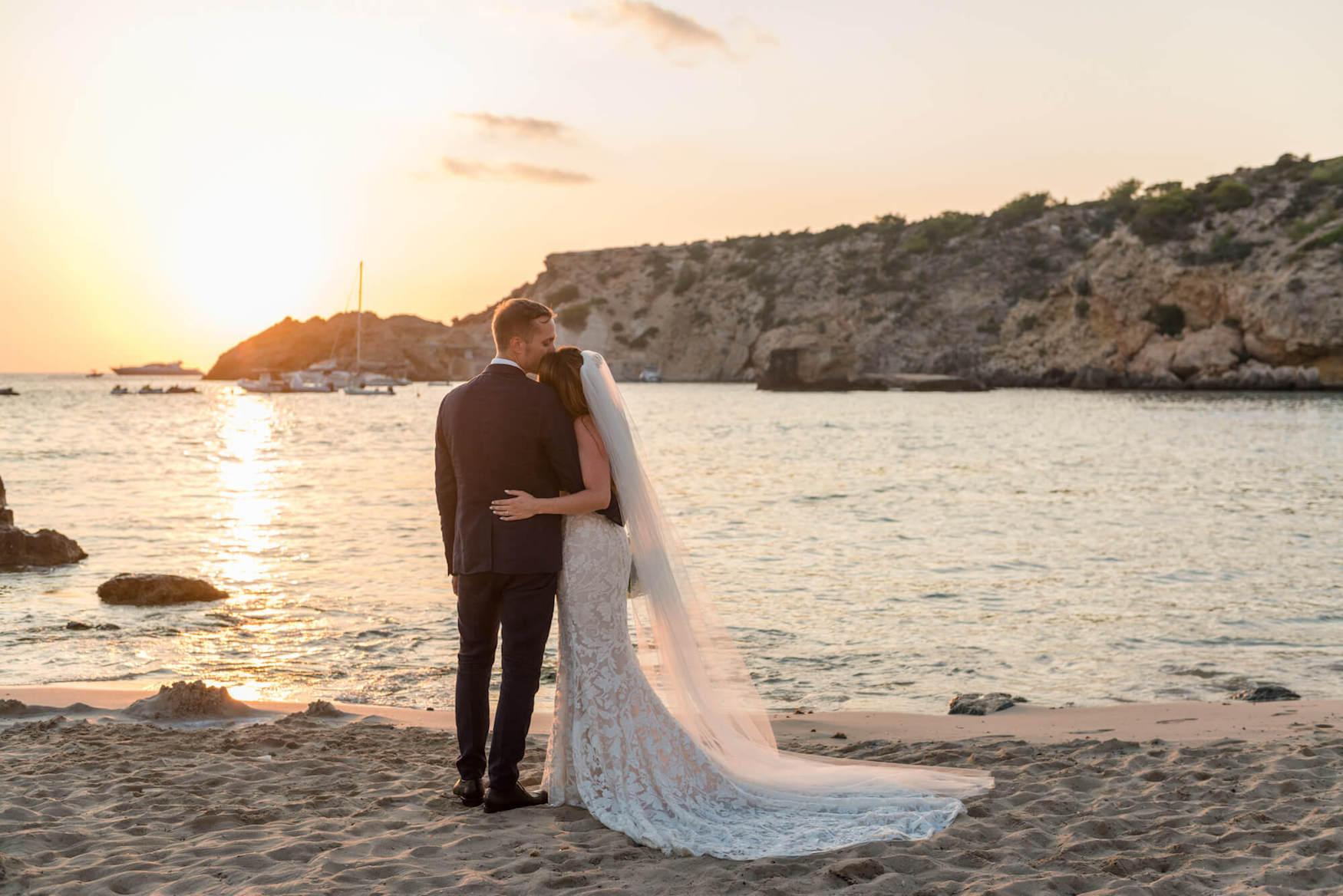 Bride and groom hugging at a sunset wedding in ibiza